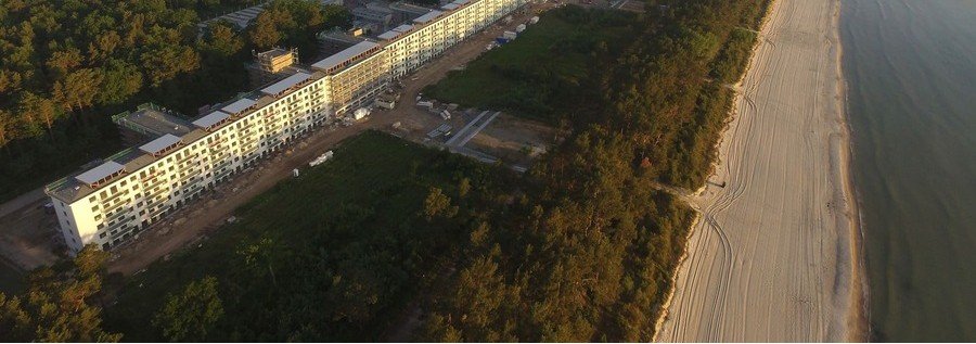 Aerial view of Prora main textile beach along the Baltic Sea with the historic Prora complex on Rügen Island Germany.
