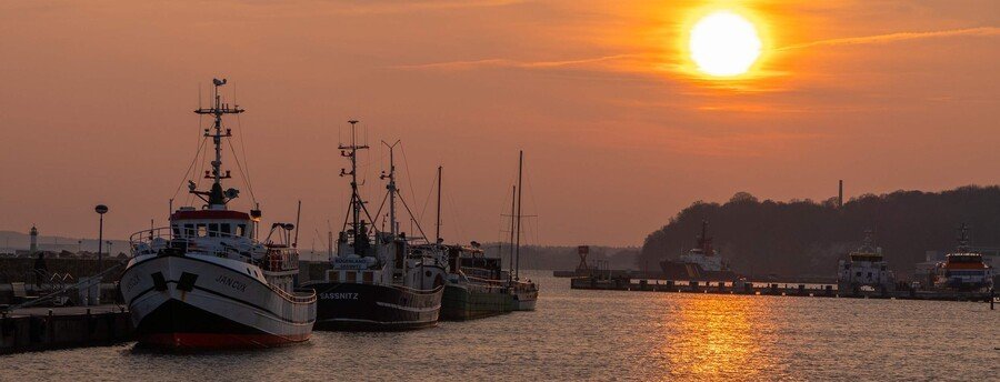 Fishing boats at sunset in Sassnitz Harbor on the Baltic Sea, Germany