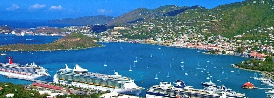 Aerial view of cruise ships docked at St Croix cruise port with harbor and town