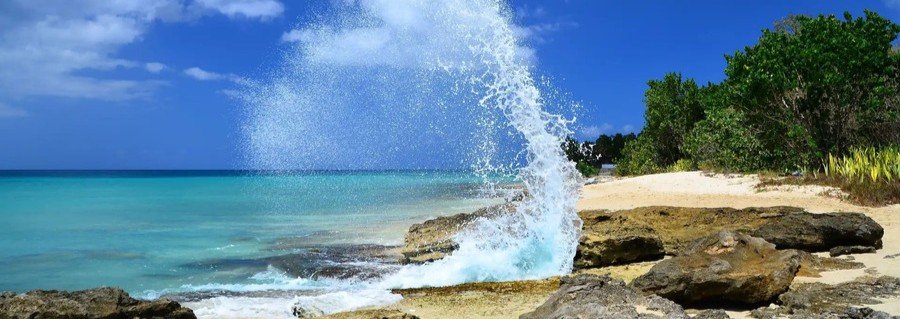 Waves crashing on rocky beach along the coastline in St Croix US Virgin Islands