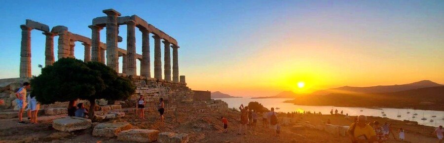 Temple of Poseidon at sunset overlooking the sea at Cape Sounion Greece