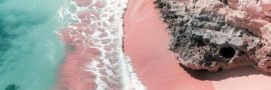 Pink sand beach in Tikehau with turquoise lagoon waves and coral shoreline in French Polynesia