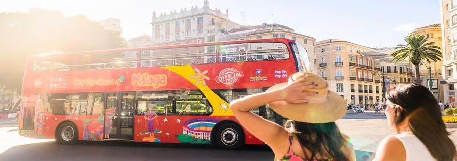 Málaga hop on hop off bus tour with red double decker bus and city streets