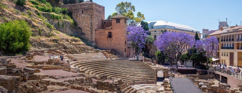 Málaga Roman Theatre with ancient stone seating and historic ruins near Alcazaba