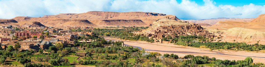 Wide panoramic view of the ancient fortified village of Aït Benhaddou, a popular UNESCO day trip from Agadir Port in the Souss-Massa region.