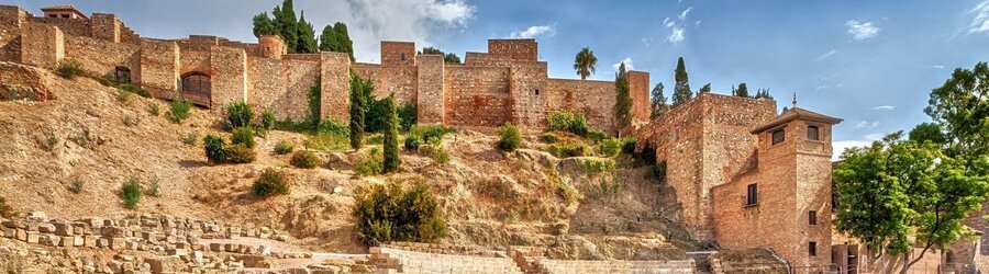 The Alcazaba Málaga fortress with stone walls, towers, and hillside views