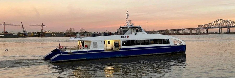 Passenger ferry on the water near Algiers Port, showing local transport and harbor activity.
