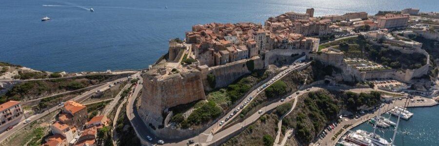 Bonifacio Citadel perched on white limestone cliffs above the sea in Corsica France
