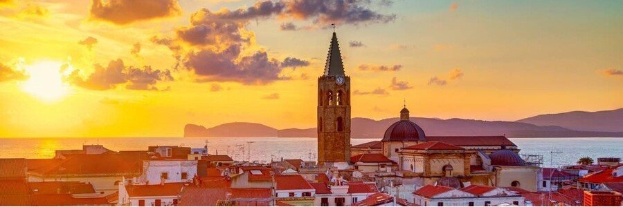 Sunset over Cagliari with city and sea