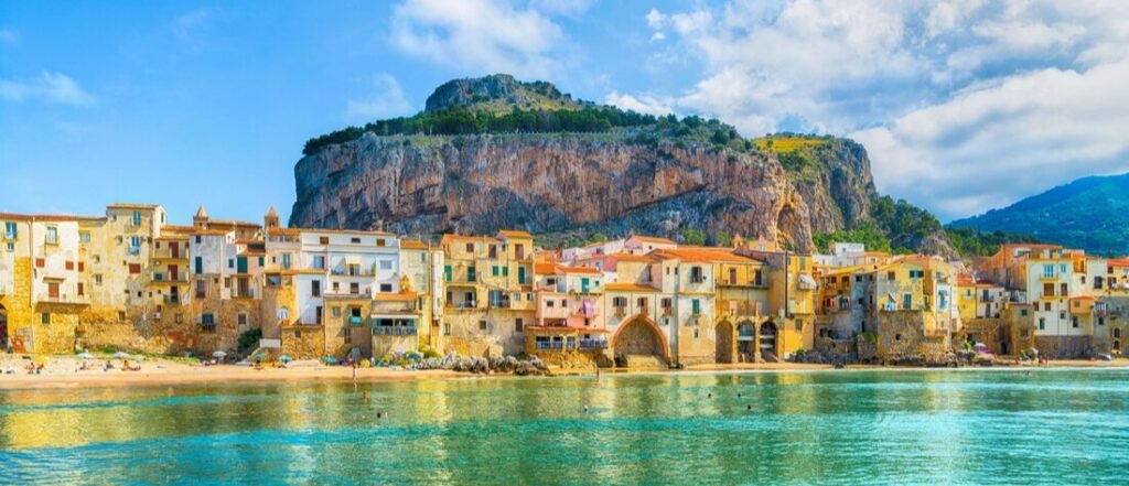 Cefalù coastal town near Palermo Port in Sicily with colorful buildings and beach views