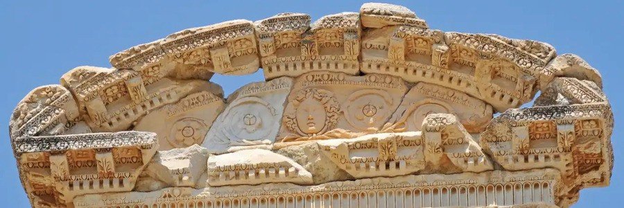 Detailed stone carvings at Ephesus ruins showing ancient craftsmanship