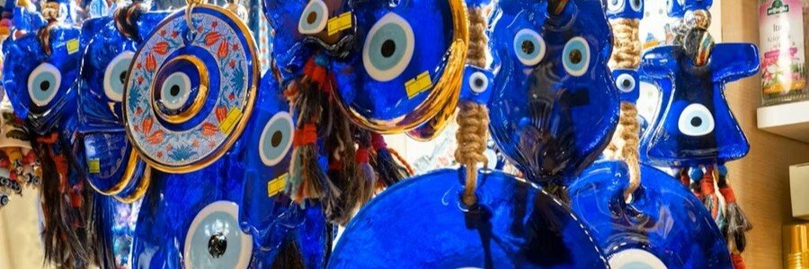 Blue evil eye souvenirs hanging in Kusadasi market