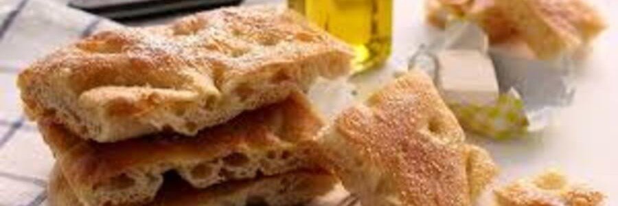 Traditional focaccia Genovese bread with olive oil and crispy texture
