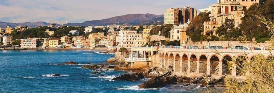 Coastal walkway in Genoa Italy with ocean views and historic architecture