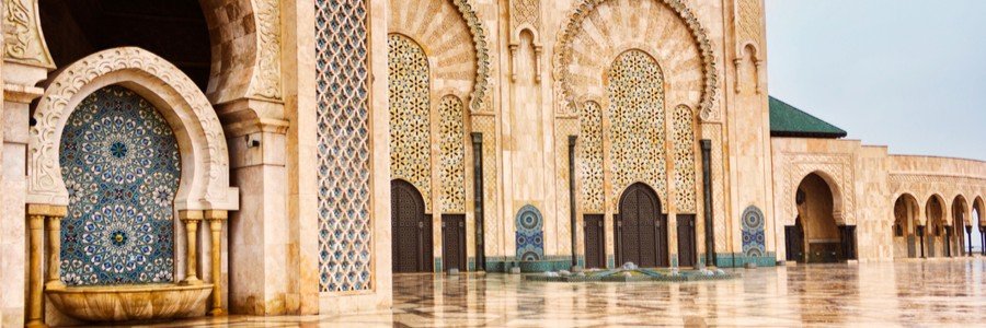 Intricate tilework and carved arches at Hassan II Mosque on a Casablanca Port shore excursion.