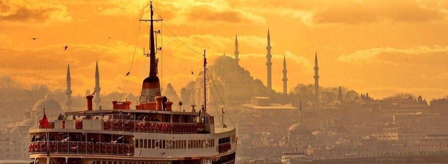 sunset cruise on Bosphorus with Istanbul skyline and mosque silhouettes
