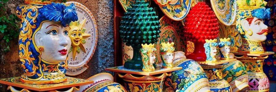 Colorful hand-painted Italian ceramics displayed in a coastal shop