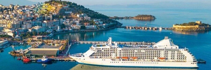 Cruise ship docked at Kusadasi Port with city and coastline views