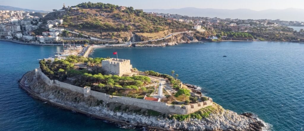 Aerial view of Pigeon Island Castle at Kuşadası Port, the historic gateway to the ancient city of Ephesus.