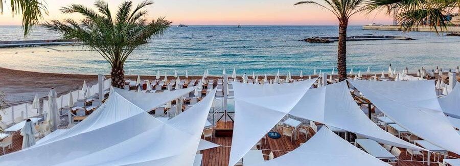 La Note Bleue Monaco beach club with white canopies and seaside views at Larvotto Beach
