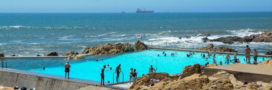 Matosinhos Beach with people swimming in tidal pool along Atlantic coast Porto