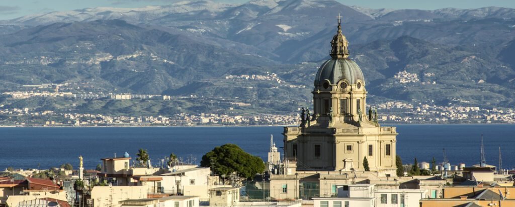 Messina Port Sicily skyline with cathedral dome and coastline overlooking the sea