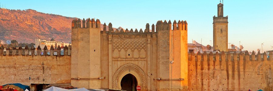 Historic Moroccan medina gate with traditional architecture near Casablanca Port excursion destinations.