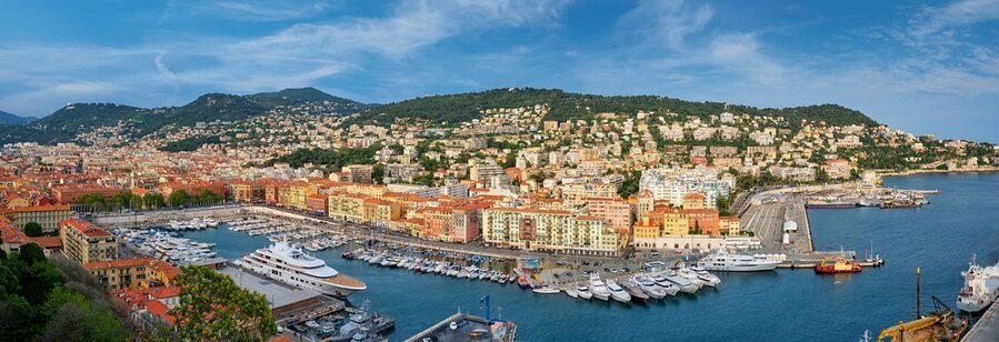 Nice Port Lympia panoramic view with harbor, yachts, and colorful buildings along the French Riviera