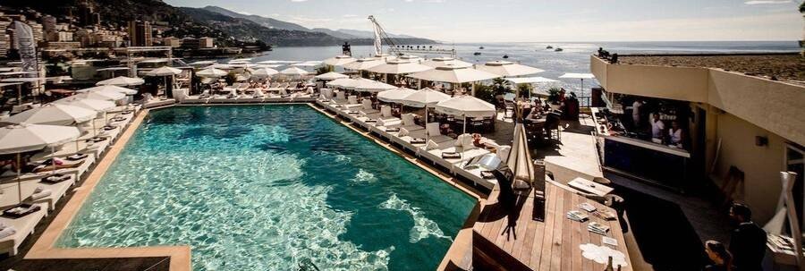 Nikki Beach Fairmont Monte Carlo rooftop pool with ocean views and lounge seating