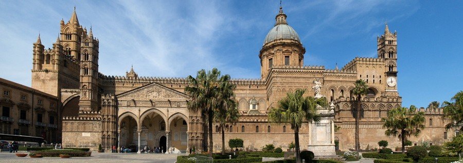 Palermo Cathedral exterior with palm trees and historic architecture in Sicily