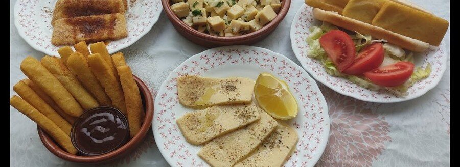Panizas from Cádiz served as chickpea fries with traditional Spanish tapas on a table