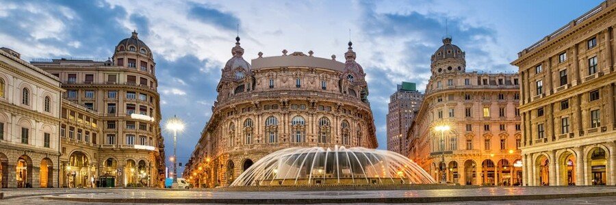 Piazza De Ferrari fountain surrounded by historic buildings in Genoa Italy