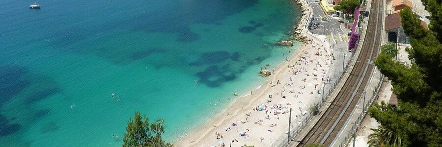Plage de la Darse beach with clear blue water and marina views in Villefranche-sur-Mer France