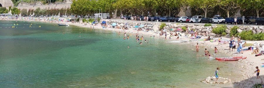 Plage de l’Ange Gardien beach with turquoise water and pebbled shoreline in Villefranche-sur-Mer France
