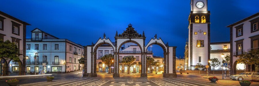 The historic Portas da Cidade (City Gates) at night in the heart of Ponta Delgada and Azores, near the cruise port. The historic Portas da Cidade (City Gates) at night in the heart of Ponta Delgada and Azores, near the cruise port.
