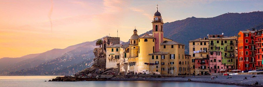 Portofino harbor at sunset with colorful buildings and golden light