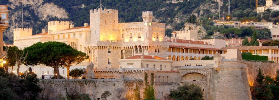 Prince’s Palace Monaco on Le Rocher with historic walls and towers at sunset