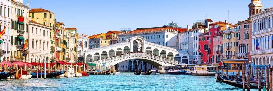 Rialto Bridge overlooking the Grand Canal with colorful buildings