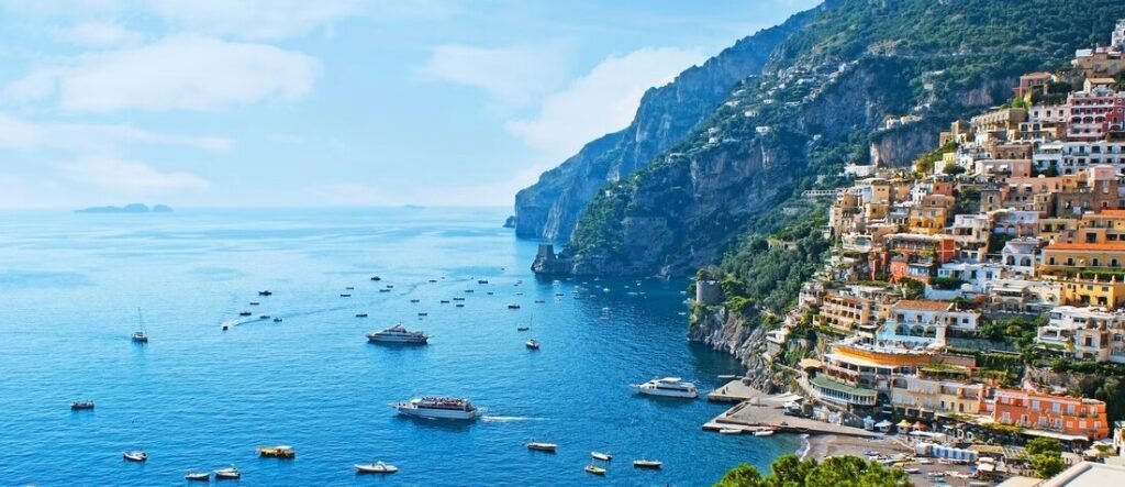 Colorful cliffside buildings overlooking the sea along the Amalfi Coast near the Salerno Port