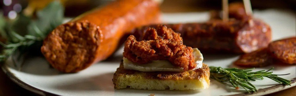sobrassada spread on bread in Mallorca with cured sausage and local herbs