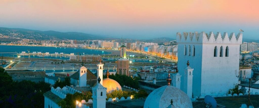 	Panoramic view of Tangier Ville Port Morocco and city skyline at sunset, seen from the historic Medina.