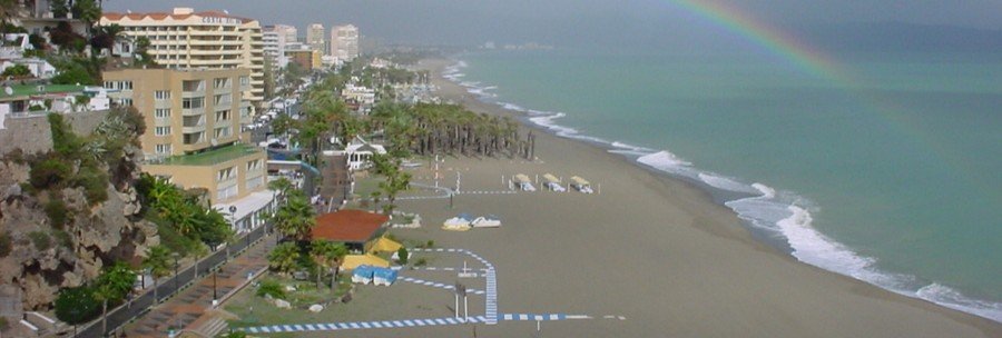 Torremolinos Beach Costa del Sol with long sandy shoreline, hotels, and ocean views