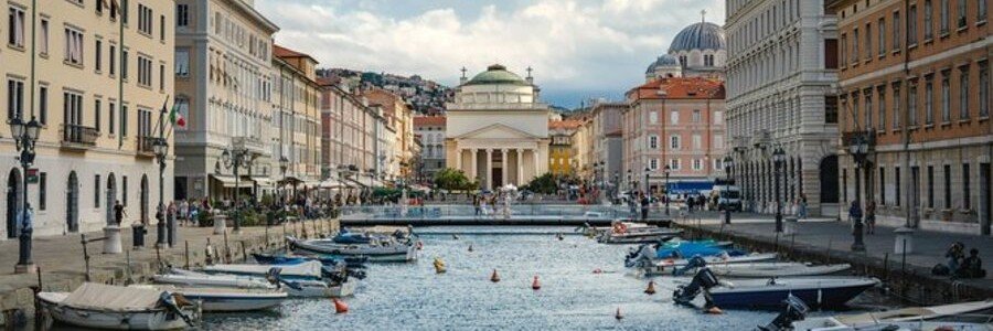 Canal Grande in Trieste near Trieste Port with boats and historic buildings