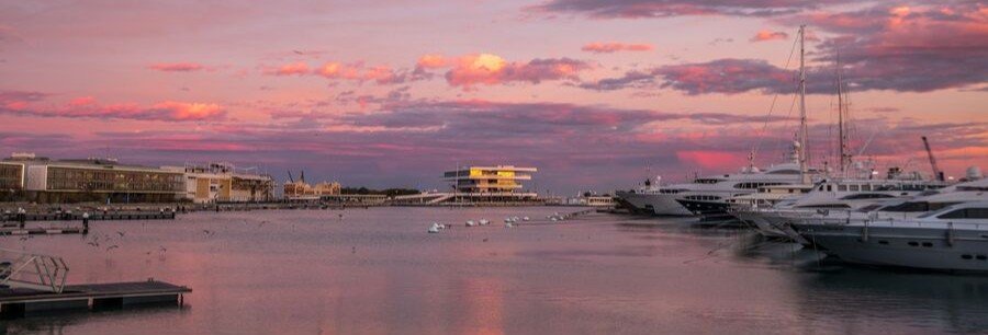 Valencia Port marina at sunset with yachts and colorful sky