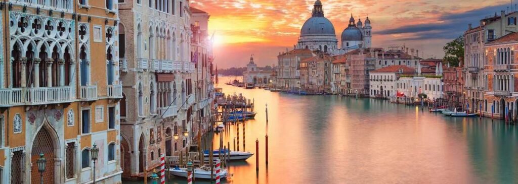 Venice Shore Excursions view of the Grand Canal at sunset with historic buildings
