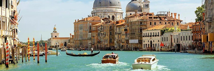 Grand Canal view with boats and Santa Maria della Salute in Venice