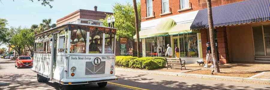 Historic trolley traveling through downtown Fernandina Beach on Amelia Island, Florida.