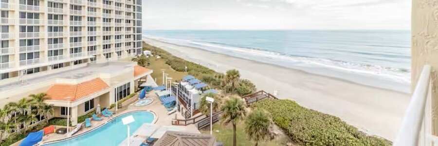 Oceanfront pool and beach view from Hilton Melbourne Beach Oceanfront in Florida.