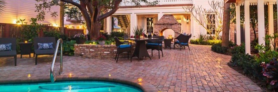Private courtyard pool and outdoor seating area at Port d'Hiver Bed and Breakfast in Melbourne Beach.