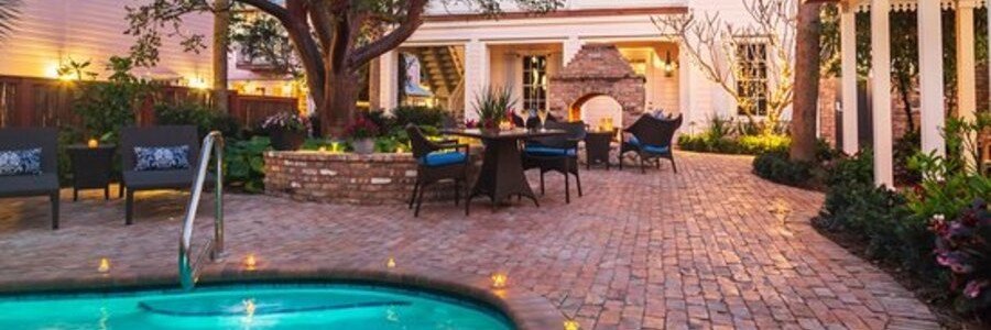 Cozy courtyard pool and outdoor seating area at Port d'Hiver near Indian Harbour Beach.
